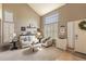 Cozy living room with high ceilings, large windows, and a neutral color palette for a relaxing ambiance at 8888 S Dudley St, Littleton, CO 80128