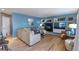 Inviting living room with a fireplace, custom shelving, and comfortable seating at 8888 S Dudley St, Littleton, CO 80128