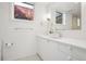 Bright bathroom featuring a white vanity and contemporary fixtures at 14 S Grape St, Denver, CO 80246
