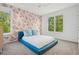 Charming bedroom with floral wallpaper and a large window with natural light at 14 S Grape St, Denver, CO 80246