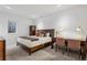 Cozy bedroom with a comfortable bed, built-in wardrobe, and desk, creating a perfect private space at 14 S Grape St, Denver, CO 80246