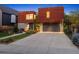 Modern home with unique architectural design, a spacious driveway, and well-maintained landscaping at 14 S Grape St, Denver, CO 80246