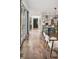 Hallway leading to dining room and kitchen, features hard wood floors and great lighting at 14 S Grape St, Denver, CO 80246