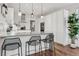 Bright kitchen featuring stainless steel appliances, modern backsplash, and an eat-in island at 14 S Grape St, Denver, CO 80246
