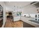 Modern kitchen with stainless appliances, sleek cabinetry, and open layout to the living areas at 14 S Grape St, Denver, CO 80246