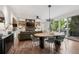 Open living space featuring modern lighting, dining area, and outdoor access at 14 S Grape St, Denver, CO 80246