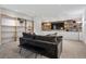 Inviting living room featuring custom shelving, a comfortable sofa, and ambient lighting at 14 S Grape St, Denver, CO 80246