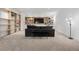 Cozy living room with built-in shelves, a large sofa, and a TV at 14 S Grape St, Denver, CO 80246