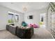 Comfortable living room with a large sofa, TV, and natural light at 14 S Grape St, Denver, CO 80246