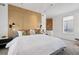 Spacious main bedroom features stylish accent lighting, a wood panel wall, and plush carpeting throughout at 14 S Grape St, Denver, CO 80246