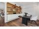 Home office setup with built-in shelves, desk, and a modern chair at 14 S Grape St, Denver, CO 80246