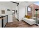 Cozy sitting area with modern bench seating, hardwood floors, and bright natural light from nearby windows at 14 S Grape St, Denver, CO 80246