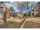 View of the well-maintained community grounds with mature trees and green grass at 11913 E Harvard Ave # 106, Aurora, CO 80014