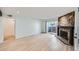 Bright living room showcasing wood flooring and natural light from the sliding door at 11913 E Harvard Ave # 106, Aurora, CO 80014