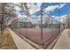 View of the complex's well-maintained tennis courts behind a chain link fence at 11913 E Harvard Ave # 106, Aurora, CO 80014