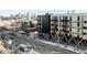 Elevated view showcases the modern architecture with city skyline at 2880 Zuni St # 308, Denver, CO 80211