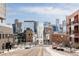 City view with snow-covered street and building exteriors at 2880 Zuni St # 308, Denver, CO 80211