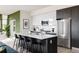 Modern kitchen with island and stainless steel appliances at 2880 Zuni St # 308, Denver, CO 80211