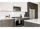 Modern kitchen with stainless steel appliances, marble backsplash, and ample counter space at 2880 Zuni St # 308, Denver, CO 80211