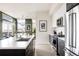 Modern kitchen with island, stainless steel appliances, and dark cabinetry at 2880 Zuni St # 308, Denver, CO 80211