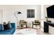 Comfortable living room with stylish seating, unique decor, and plenty of natural light at 2880 Zuni St # 308, Denver, CO 80211