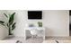 Bright office space includes a white desk, modern chair, and vibrant indoor plants at 2880 Zuni St # 308, Denver, CO 80211