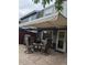Spacious back patio with awning and outdoor seating, great for entertaining at 9060 E Cherry Creek South Dr # E, Denver, CO 80231