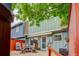 Backyard patio with outdoor seating, retractable awning and lush landscaping at 9060 E Cherry Creek South Dr # E, Denver, CO 80231
