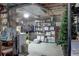 Unfinished basement storage area includes shelving, hanging rack and utility area at 9060 E Cherry Creek South Dr # E, Denver, CO 80231
