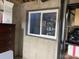 Basement storage area with shelving, window and concrete foundation at 9060 E Cherry Creek South Dr # E, Denver, CO 80231