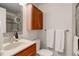 Bright bathroom featuring a vanity, cabinet, and a large mirror at 9060 E Cherry Creek South Dr # E, Denver, CO 80231
