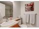 Updated bathroom features neutral colors, vanity, mirror, and shower at 9060 E Cherry Creek South Dr # E, Denver, CO 80231