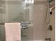 Modern bathroom with a glass-enclosed shower and subway tile at 9060 E Cherry Creek South Dr # E, Denver, CO 80231