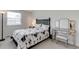 Cozy bedroom with natural light, vanity, and a comfortable bed at 9060 E Cherry Creek South Dr # E, Denver, CO 80231