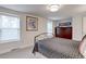 Well-lit bedroom featuring bright windows and a spacious layout with a wooden dresser at 9060 E Cherry Creek South Dr # E, Denver, CO 80231