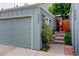 Charming home with a tidy two car garage and landscaped walkway at 9060 E Cherry Creek South Dr # E, Denver, CO 80231