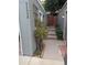 Charming front entrance of home with flower accent and walkway to wooden gate at 9060 E Cherry Creek South Dr # E, Denver, CO 80231