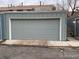View of the exterior garage showcasing its spacious size and neutral color at 9060 E Cherry Creek South Dr # E, Denver, CO 80231
