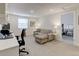 Relaxing home office area with natural light, a cozy couch, and built-in desk space, enhancing productivity at 9060 E Cherry Creek South Dr # E, Denver, CO 80231