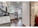 Bright kitchen with stainless-steel appliances, granite countertops, and white cabinetry at 9060 E Cherry Creek South Dr # E, Denver, CO 80231