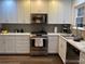 Beautifully updated kitchen featuring stainless steel appliances and white cabinetry at 9060 E Cherry Creek South Dr # E, Denver, CO 80231