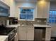 Well-designed kitchen with stainless steel appliances, ample counter space, and modern finishes at 9060 E Cherry Creek South Dr # E, Denver, CO 80231