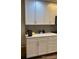 Contemporary kitchen featuring granite countertops and modern cabinetry at 9060 E Cherry Creek South Dr # E, Denver, CO 80231