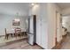 Kitchen with white cabinets and stainless-steel refrigerator at 9060 E Cherry Creek South Dr # E, Denver, CO 80231