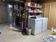 Utility room includes washer, dryer and storage shelves at 9060 E Cherry Creek South Dr # E, Denver, CO 80231