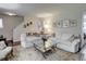 Bright living room featuring two plush sofas and a glass coffee table at 9060 E Cherry Creek South Dr # E, Denver, CO 80231