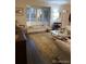 Bright living room featuring a bay window and hardwood floors at 9060 E Cherry Creek South Dr # E, Denver, CO 80231