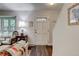 Cozy living room showcases a white front door and hardwood floors at 9060 E Cherry Creek South Dr # E, Denver, CO 80231