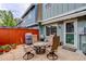 Inviting stone patio with seating and a grill, perfect for outdoor entertaining at 9060 E Cherry Creek South Dr # E, Denver, CO 80231