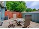 Serene patio featuring stone pavers and outdoor seating beneath mature trees at 9060 E Cherry Creek South Dr # E, Denver, CO 80231